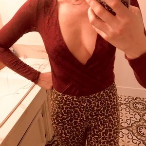 Plunging neckline free people body suit